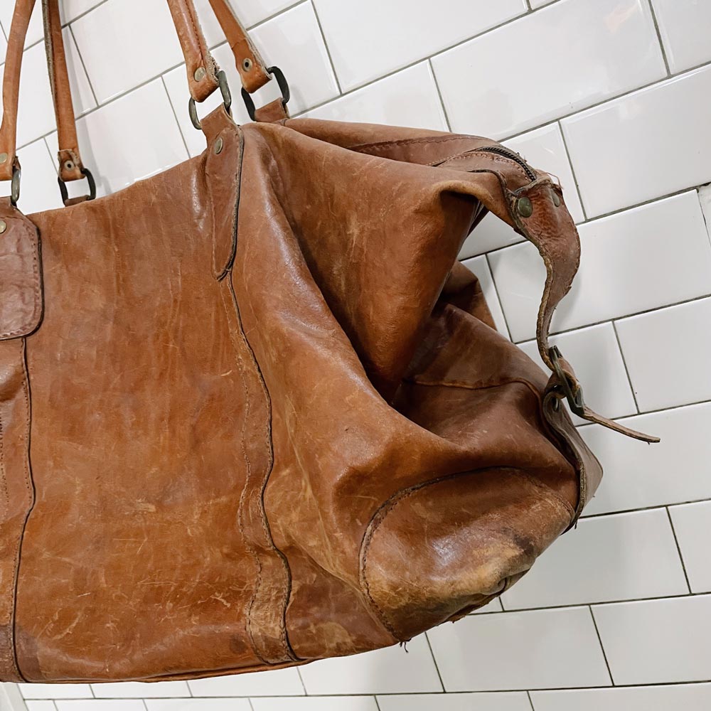 vintage large distressed leather travel bag