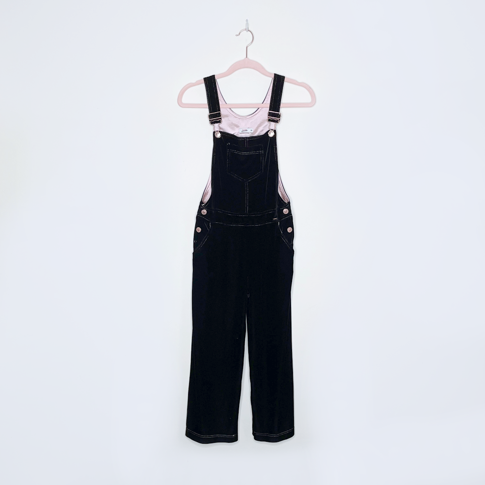 Black overalls in sales store